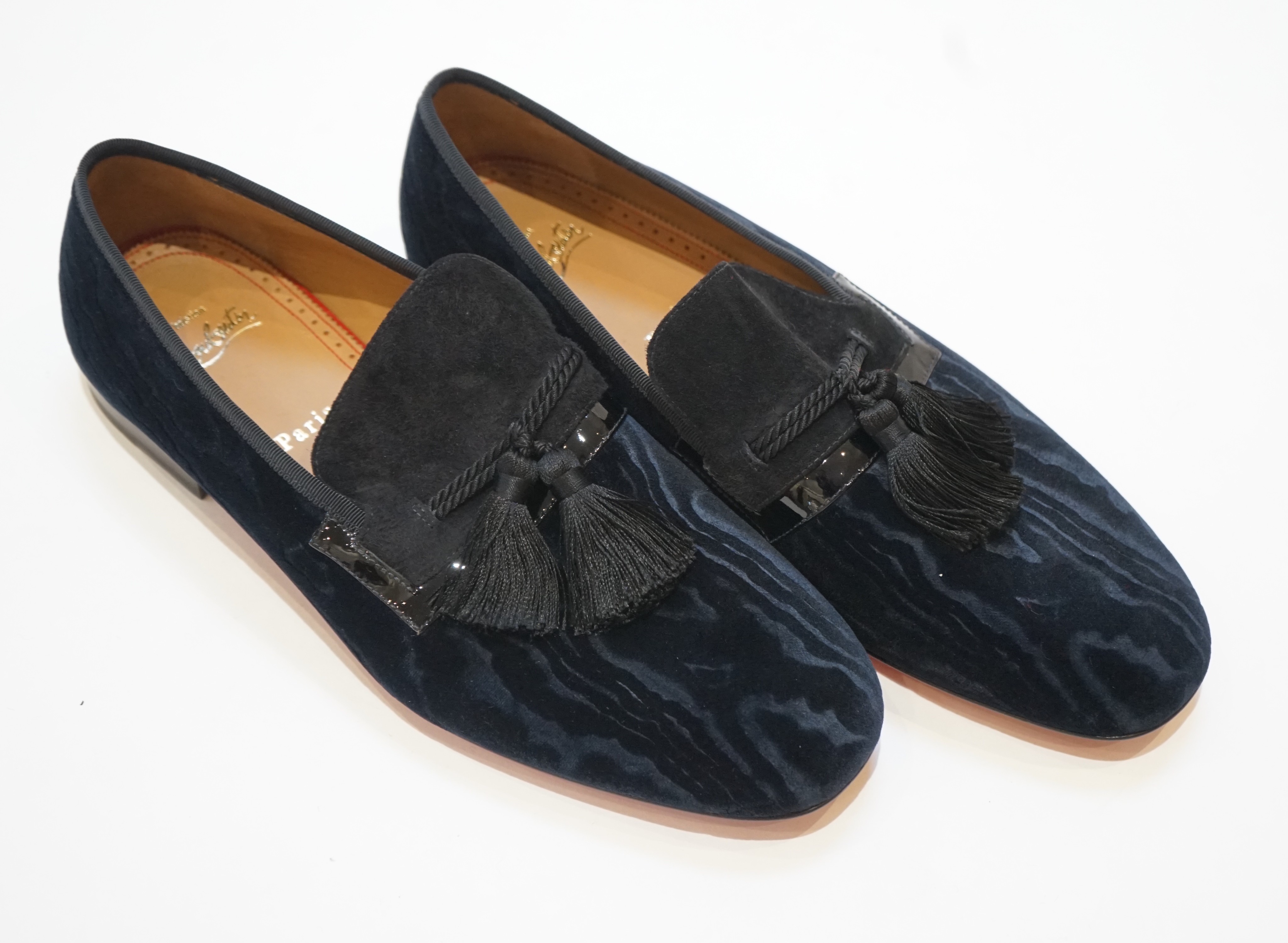 A pair of gentleman's Christian Louboutin navy blue watered velvet and suede evening slippers with black tassels (unworn), size 42.5, in bag